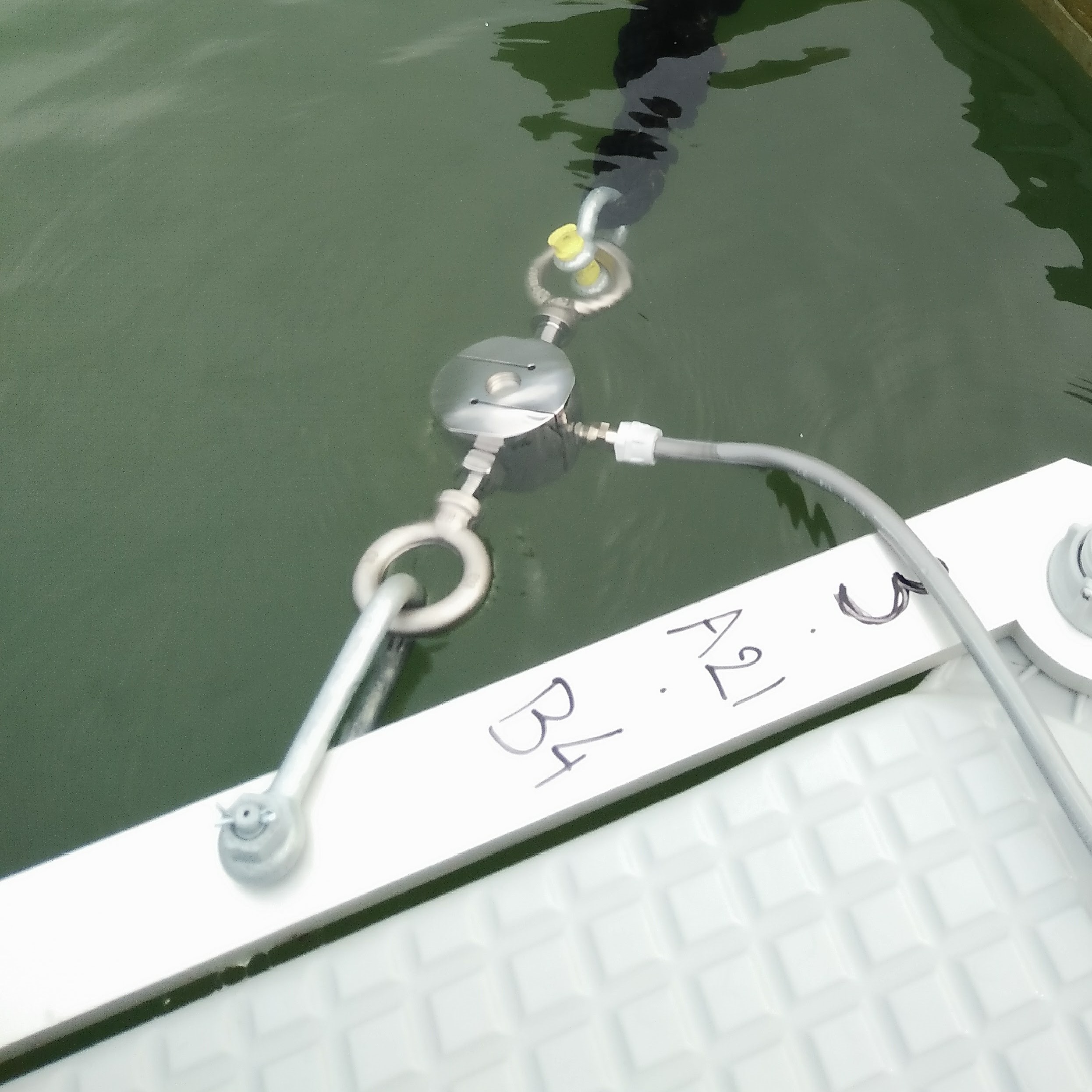 Anchoring system for floating solar