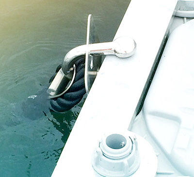 The adjustment of the mooring lines to finalize the anchoring.